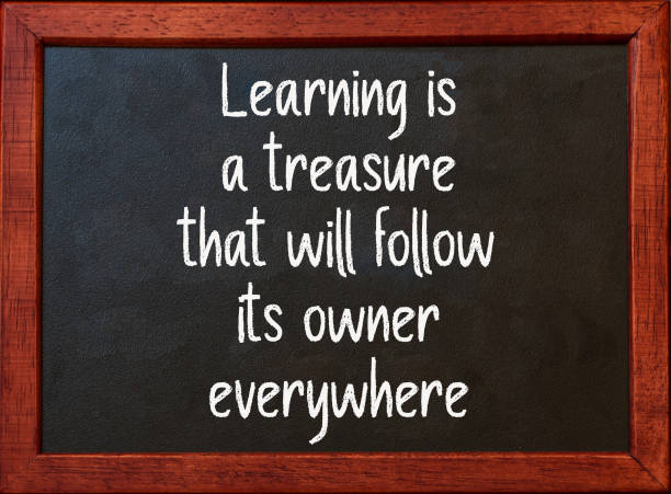 istock Learning is a treasure. Motivational quote on blackboard. 1385622286