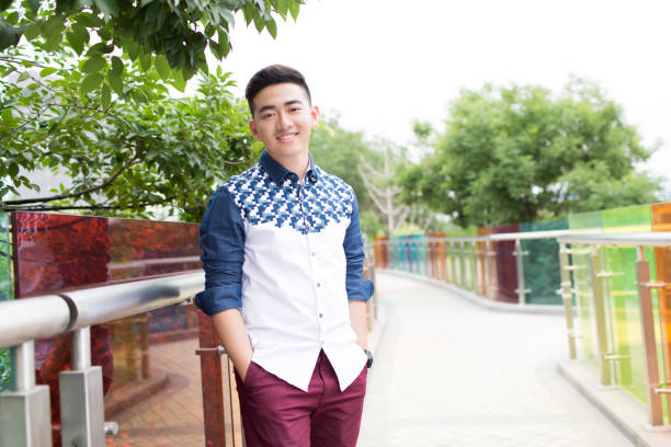 istock young handsome man in the park 1385624102