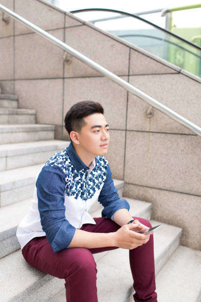 istock young handsome man in the park 1385624574