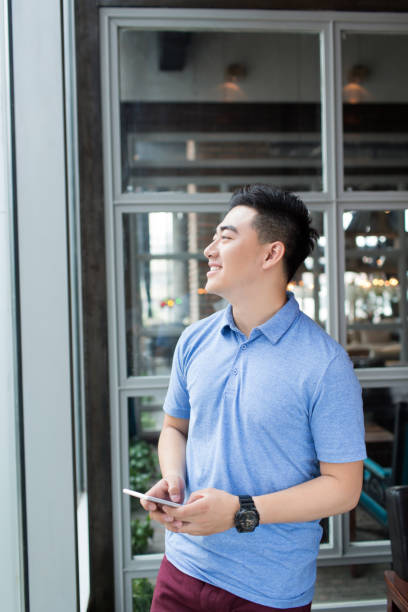 istock man wearing a blue T-shirt 1385625191