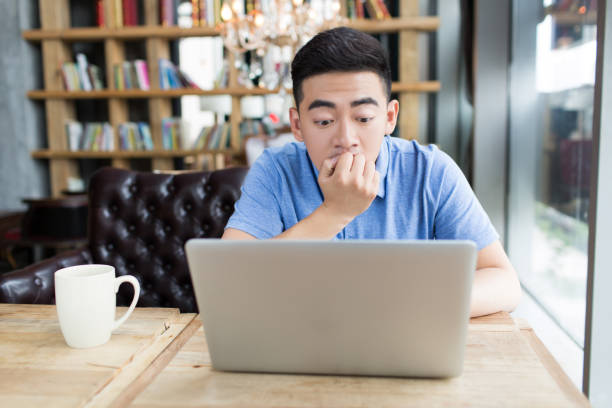istock young handsome man in coffee shop 1385625397