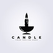 istock Black and white candle light flame logo in cup vector illustration design 1385625513