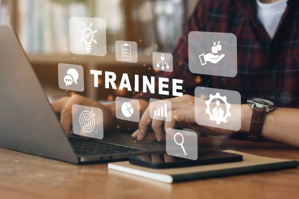 istock Person working on computer with icons of Trainee program and apprenticeship On the Job Training Learning. 1385627078