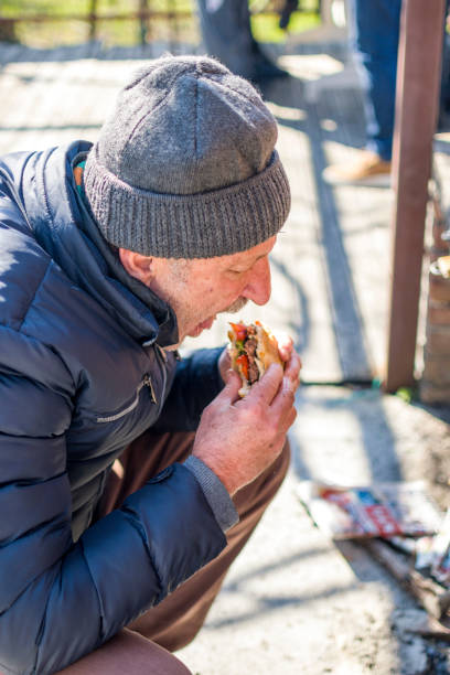 istock Man eating meatballs on barbecue 1385628172