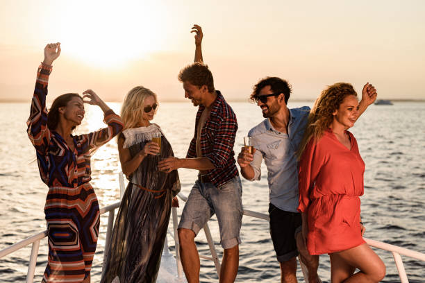 istock Carefree friends having fun while dancing on a boat. 1385628245