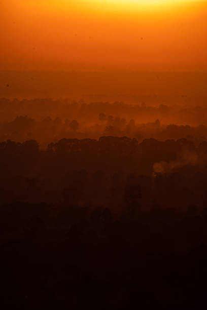 istock nature sunset landscape scene view, panorama natural view for using in background or concept of environmental and sustainable development, The sun downing over the cloud sky and local mountain land 1385631118