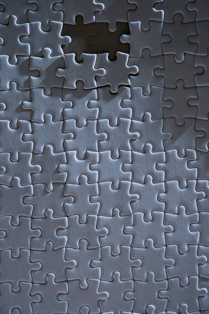 istock Close up of textured white jigsaw puzzle 1385636967