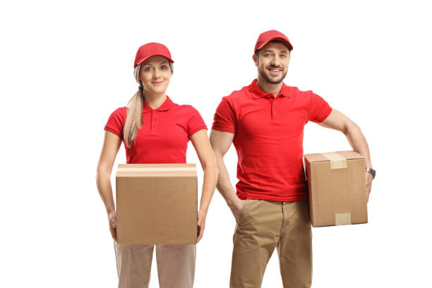 istock Delivery man and woman holding packages 1385638552