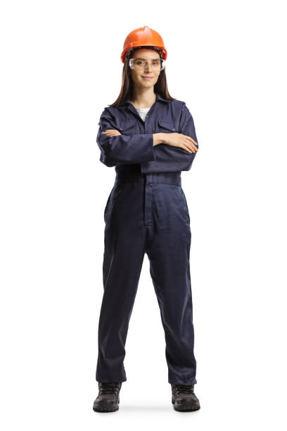trabajadora con uniforme con casco y gafas posando - overalls fotografías e imágenes de stock