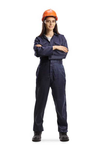 female worker in a uniform with a helmet and goggles posing - industrial objects imagens e fotografias de stock