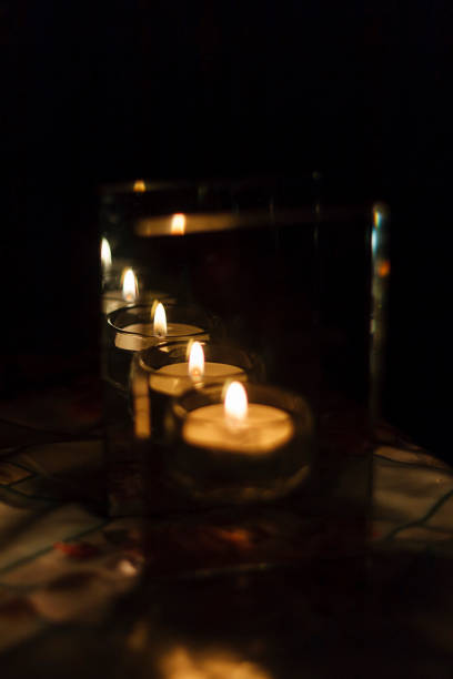 istock candle in a candlestick with parallel walls which give a lot of reflections 1385646649