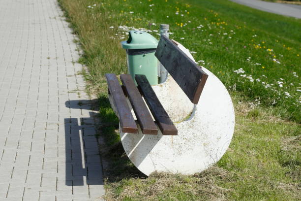 istock Wooden bench and concrete on a dike, Germany, Europe 1385648088