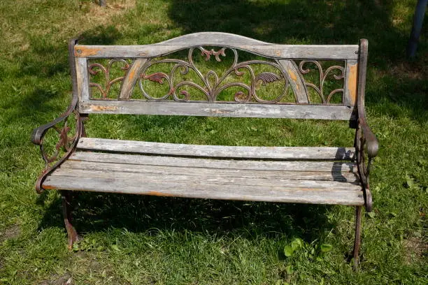 Old wooden bench on a meadow, Germany, Europe