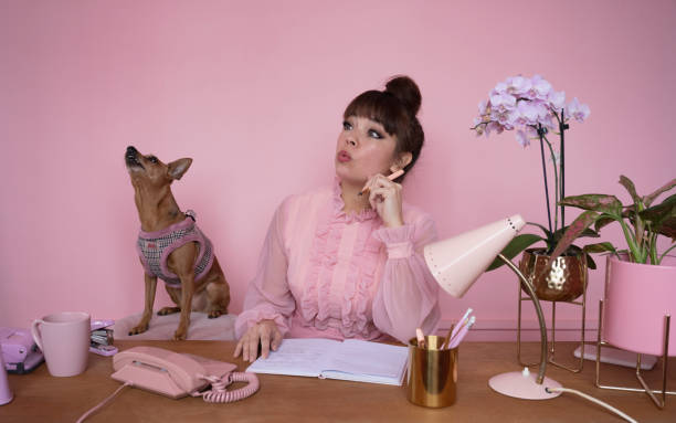 istock Howling dog and eccentric businesswoman at work 1385655740