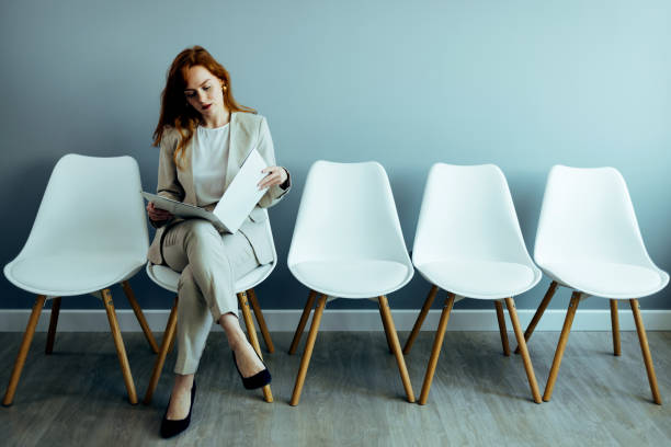 istock Woman Sitting in a Waiting Room 1385658172