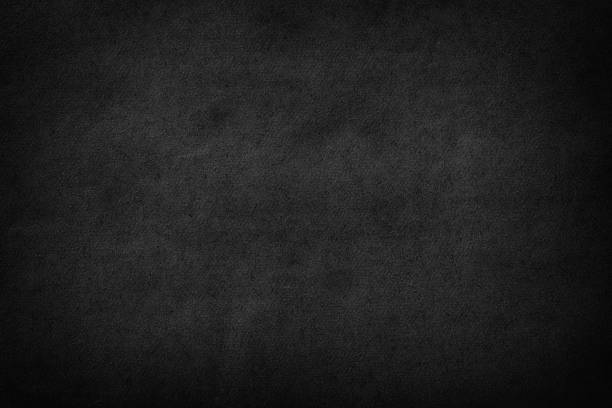 istock black paper texture. black sheet of cardboard as a background 1385658280