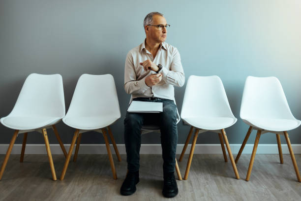 istock A mature man sitting in a waiting room 1385658389