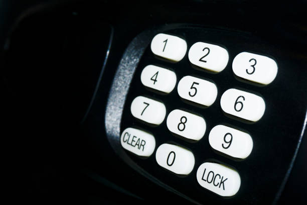 istock Simple electronic safe background. Buttons with numbers isolated on black. Money satefy vault. Secret code keypad. 1385662857