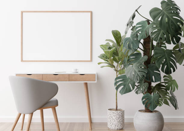 istock Empty horizontal picture frame on white wall in modern room. Mock up interior in contemporary style. Free space, copy space for your picture, poster. Desk, chair, plants, parquet floor. 3D rendering. 1385663347