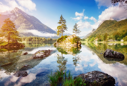 Famous tourist attraction of calm lake Hintersee. Picturesque day scene. Location resort Ramsau, National park Berchtesgadener Land, Upper Bavaria, Germany Alps, Europe. Discover the world of beauty.