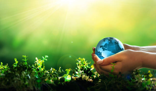 istock Earth Day. Environment day, save clean planet, ecology concept. Renewable energy-based green businesses can limit climate change and global warming. 1385666990