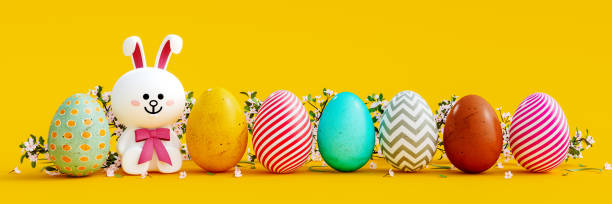 istock White bunny with colorful eggs and decoration on yellow Easter background 1385667060