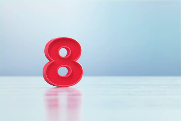 istock Red Number 8 Sitting Before Black Background 1385667087