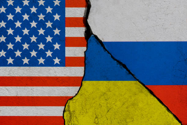 istock Ukrainian, American and Russian flags on broken cracked wall 1385667146