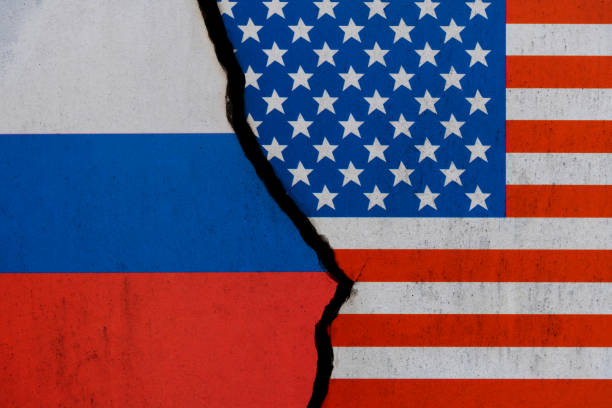 istock Russian and American flags on broken cracked wall 1385667179