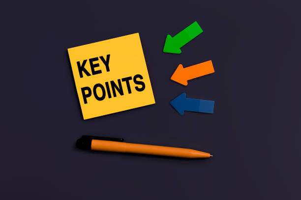 istock KEY POINTS - concept of text on sticky note. Business concept. Orange square sticky note, pen and colorful arrows on dark blue background, top view 1385667338