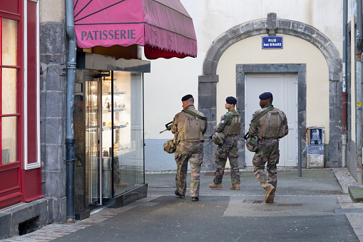 Clermont-Ferrand, France - December 11 2019: French soldiers patrolling near in the city center in order to spot any suspicious activities.