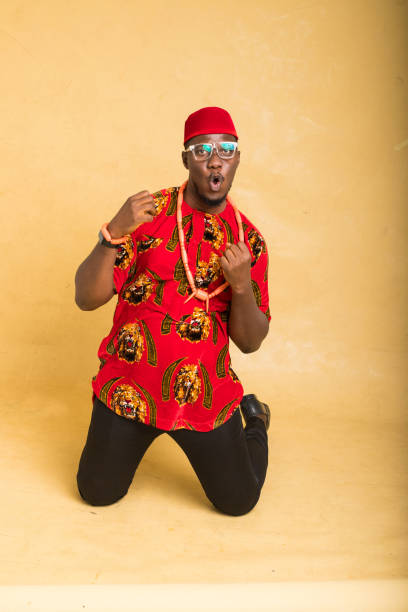 istock Igbo Traditionally Dressed Business Man Kneel and Happy 1385667422