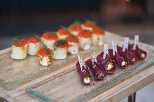 istock small appetizers with red caviar and meat rolls 1385668833