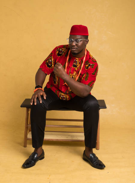 istock Igbo Traditionally Dressed Business Man Sitting Down and Calmly Celebrate 1385669372