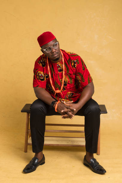 istock Igbo Traditionally Dressed Business Man Sitting Down and Stare away 1385669414
