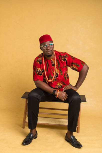 istock Igbo Traditionally Dressed Business Man Sitting Down 1385669934