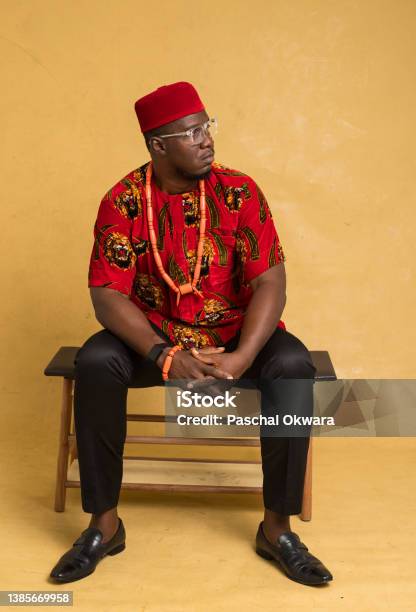 Igbo Traditionally Dressed Business Man Sitting Down And Look To The Side Stock Photo - Download Image Now