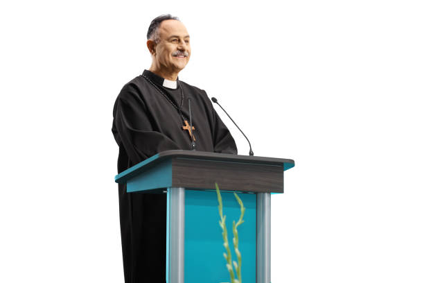 istock Mature priest giving a speech on a podium 1385677629
