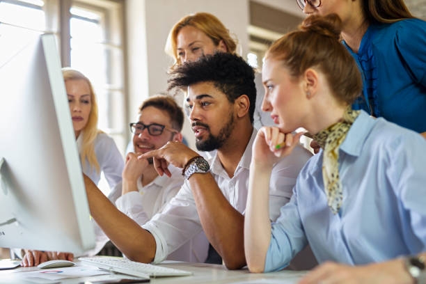 istock Group of multiethnic business people cooperating during business training 1385677866
