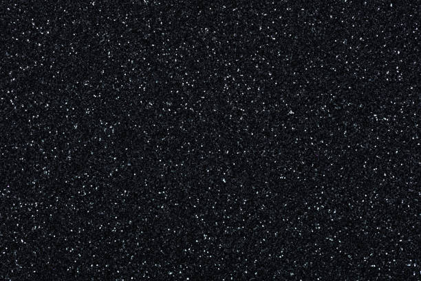 istock Glitter background, new texture in strict black tone with sparkles. 1385684035