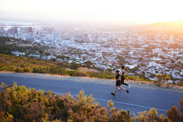 istock People jogging along a scenic mountain road on a late summer afternoon 1385687005