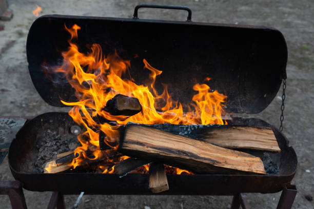 istock Brightly burning wood. Barbeque outdoors. Homemade grill 1385692456