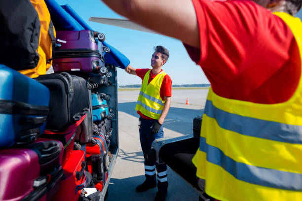 istock Airport service crew loading luggage 1385693913