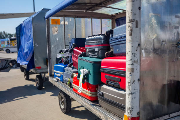 Moving cart with baggage pushed by porter