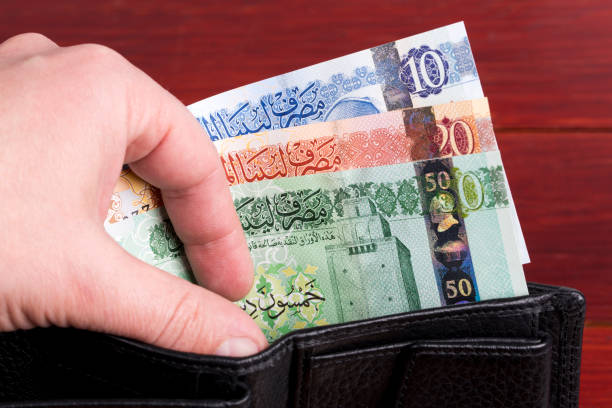 istock Libyan dinar in the black wallet 1385695796