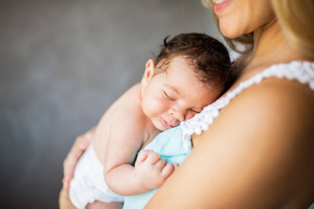 istock Newborn baby in mother's arms 1385697111