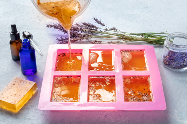 istock Handmade soap, the process of making. Liquid glycerin with lavender buds 1385698781
