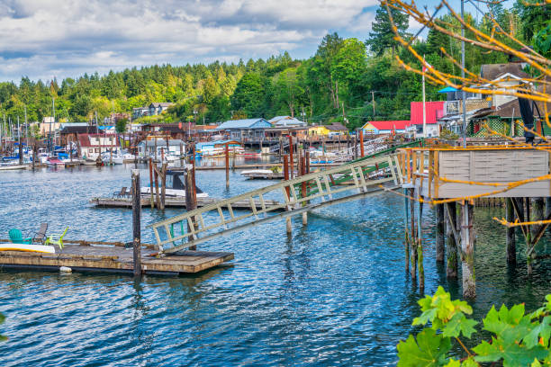 Cowichan Bay boats and wooden homes on a beautiful summer day, Vancouver Island - Canada. Cowichan Bay boats and wooden homes on a beautiful summer day, Vancouver Island - Canada duncan british columbia stock pictures, royalty-free photos & images