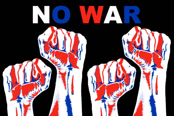 istock A fist Raising Up to Against War on Black Background 1385701199