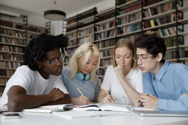 istock Concentrated multiethnic young students preparing for exams. 1385706058